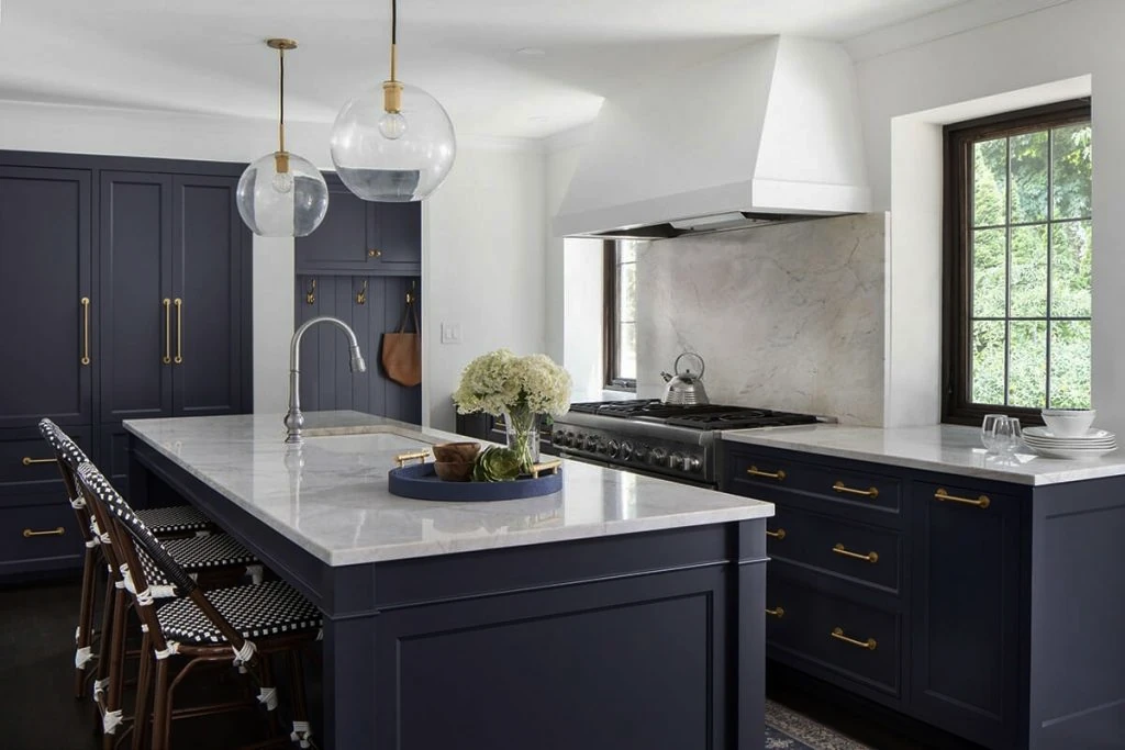 Bold navy blue kitchen cabinets showing current color trends