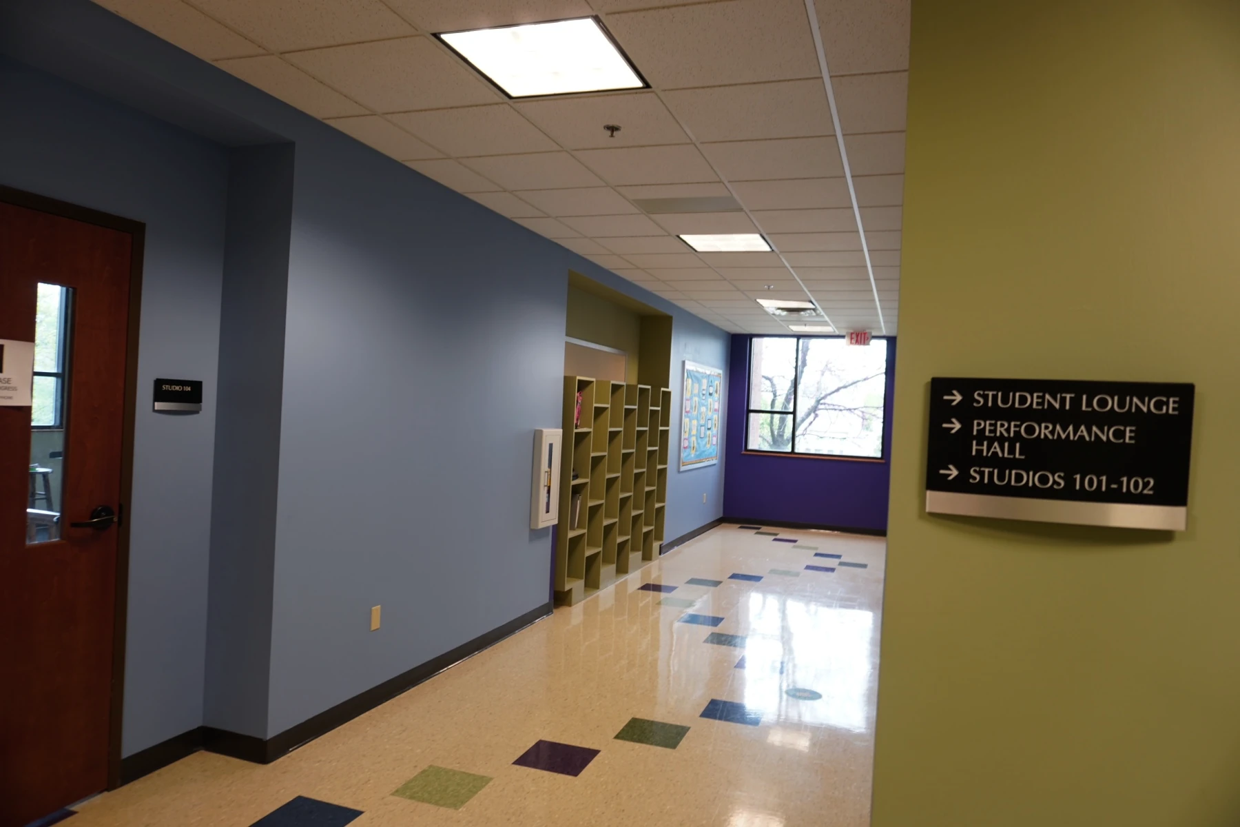School hallway with bright, colorful paint and polished floors