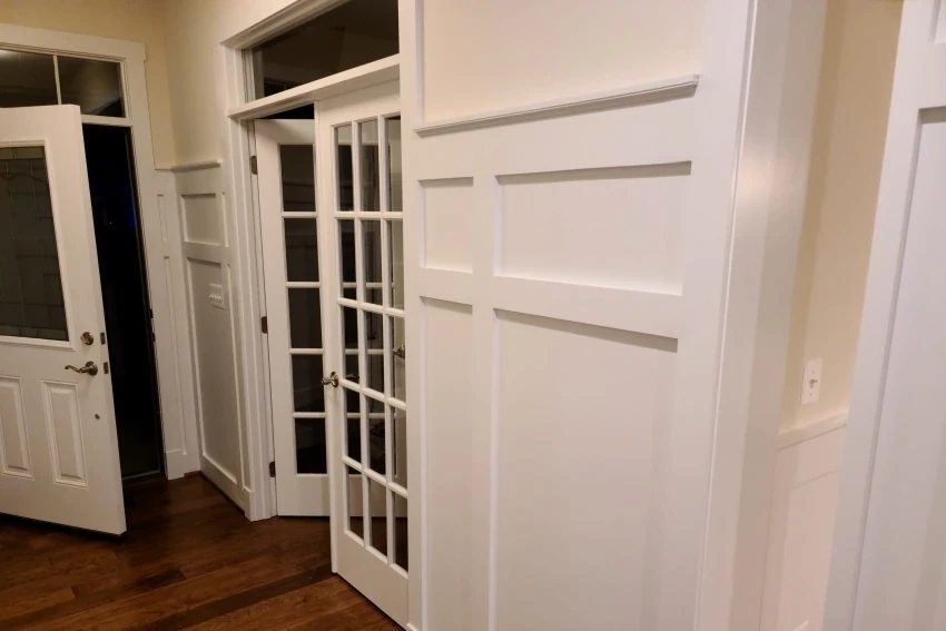 High-end trim installation showing precise mitered corners and clean lines