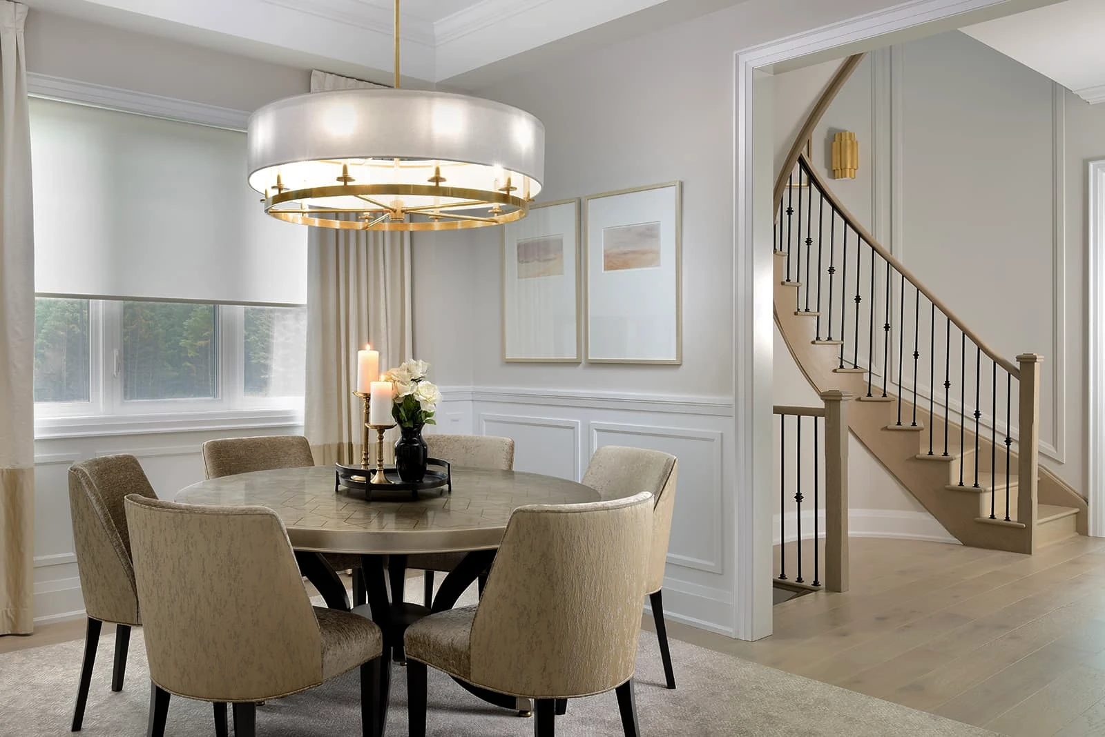 Elegant dining room with wainscoting and chair rails showing refined detail work