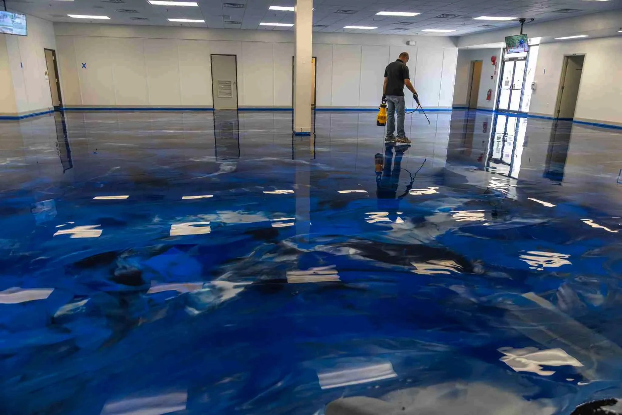 Stunning blue metallic epoxy floor in commercial space