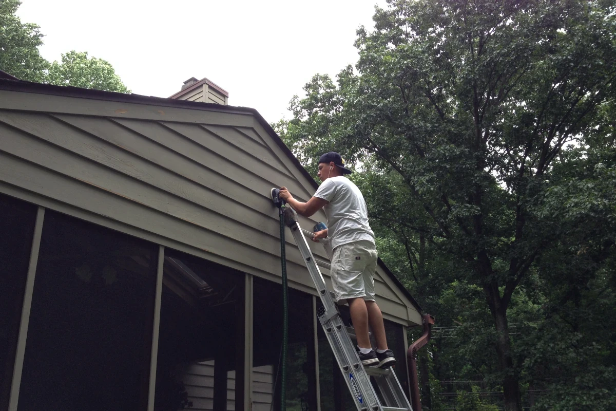 Exterior surface preparation with dustless sanding technology